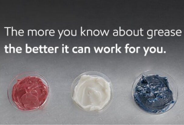 Three samples of red, white, and blue industrial grease displayed in clear containers with the text: “The more you know about grease, the better it can work for you.”